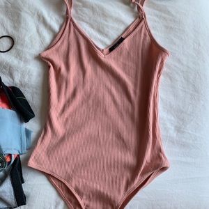 Pink ribbed body suit